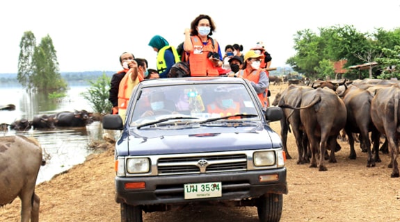 Dr. Sirikachorn conducting fieldwork during flooding.